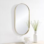 Renwil Aleah Satin Brass Capsule Wall Mirror MT2537 - capsule wall mirror styled above a console