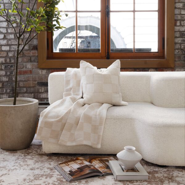 Renwil Grandi Ivory and Cream Checkerboard Cotton Throw 70 x 50 — Grandi throw draped over a sofa
