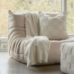 Renwil Terrah Ivory Knitted Cotton Pillow 20 x 20 PWFL1451 - ivory cotton pillow styled on an upholstered chair