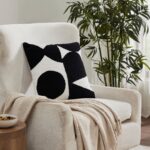 Renwil Mauro Black and Off-White Handwoven Poly-Chenille Pillow 20 x 20 PWFL1467 - Mauro pillow styled on a chair