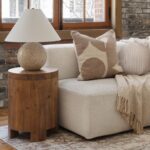 Renwil Ferla Beige and Cream Handwoven Poly-Chenille Pillow 20 x 20 PWFL1468 - neutral patterned pillow beside a window