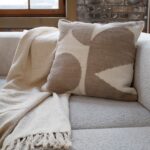 Renwil Ferla Beige and Cream Handwoven Poly-Chenille Pillow 20 x 20 PWFL1468 - Ferla pillow styled on a sofa