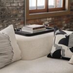 Renwil Hudson Black Wood Tray — styled on an ottoman with a book