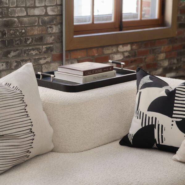 Renwil Hudson Black Wood Tray — styled on an ottoman with a book