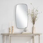 Renwil Jacossa Champagne Shaped Wall Mirror MT2712 - styled wall mirror above a light wood console