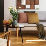 Renwil Claudia Rust Poly-Velvet Pillow 24 x 24 PWFL1328 - rust accent pillow styled on a sofa