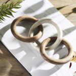 Renwil Lusine Decorative Sculpture — styled on a book on a wood surface