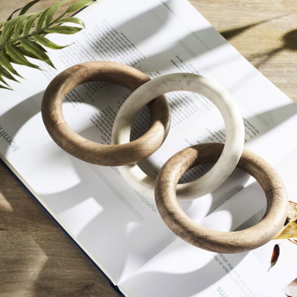 Renwil Lusine Decorative Sculpture — styled on a book on a wood surface