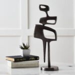 Renwil Pacino Decorative Sculpture — styled on a console beside books