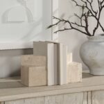 Renwil Attle Travertine Bookends - Set of 2 — styled supporting books on a console