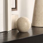 Renwil Cereza Travertine Sphere Sculpture — styled beside books and decorative objects