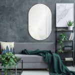 Renwil Webster Black Iron Oval Wall Mirror MT2394 - mirror styled above a sofa