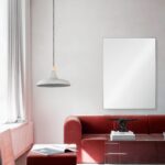 Renwil Carmelle Polished Stainless Steel Wall Mirror MT2346 - mirror styled above a red sofa