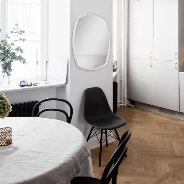 Renwil Spalding Beveled Frameless Shaped Wall Mirror MT950 - mirror styled in a bedroom