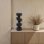 Renwil Shah Black Wood Sculpture — styled on a console beside a vase