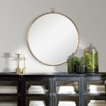 Renwil Azam Bronze Round Wall Mirror MT2356 - mirror styled above a dark cabinet