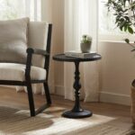 Renwil Yates Black Cast Aluminum Accent Table — table styled beside a chair; accessories not included