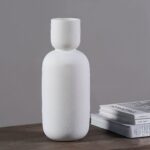 Renwil Dior White Glazed Ceramic Vase — white vase displayed beside books; accessories not included