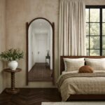 Renwil Ignatius Walnut-Finish Twisted-Frame Full-Length Mirror MT2769 - full-length mirror in a furnished bedroom