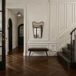 Renwil Reverie Walnut-Stained Shaped Wood Wall Mirror MT2797 - mirror styled in an entryway