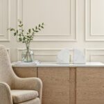 Renwil Kaleido Marble Bookends - Set of 2 — styled on a console with books and a vase