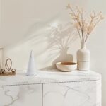 Renwil Silica White Marble Sculpture — styled on a marble console with decorative accessories